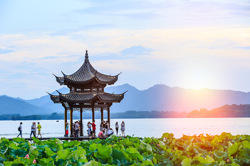 ancient pavilion of Hangzhou west lake at dusk, in China