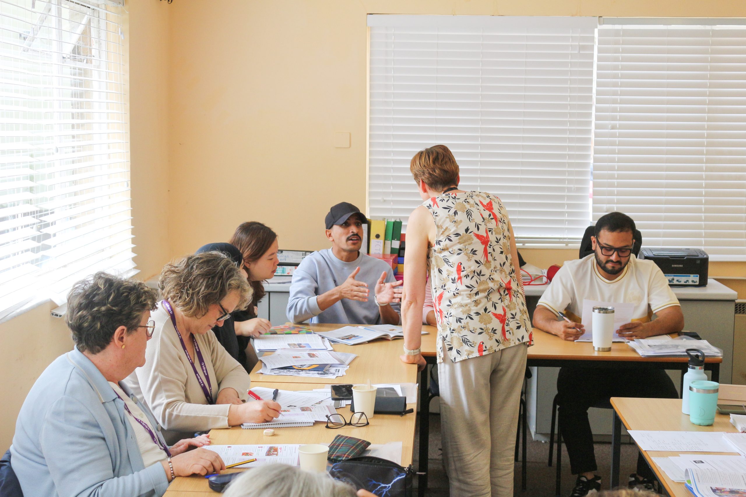 A bright classroom with students and a teacher at inlingua Cheltenham