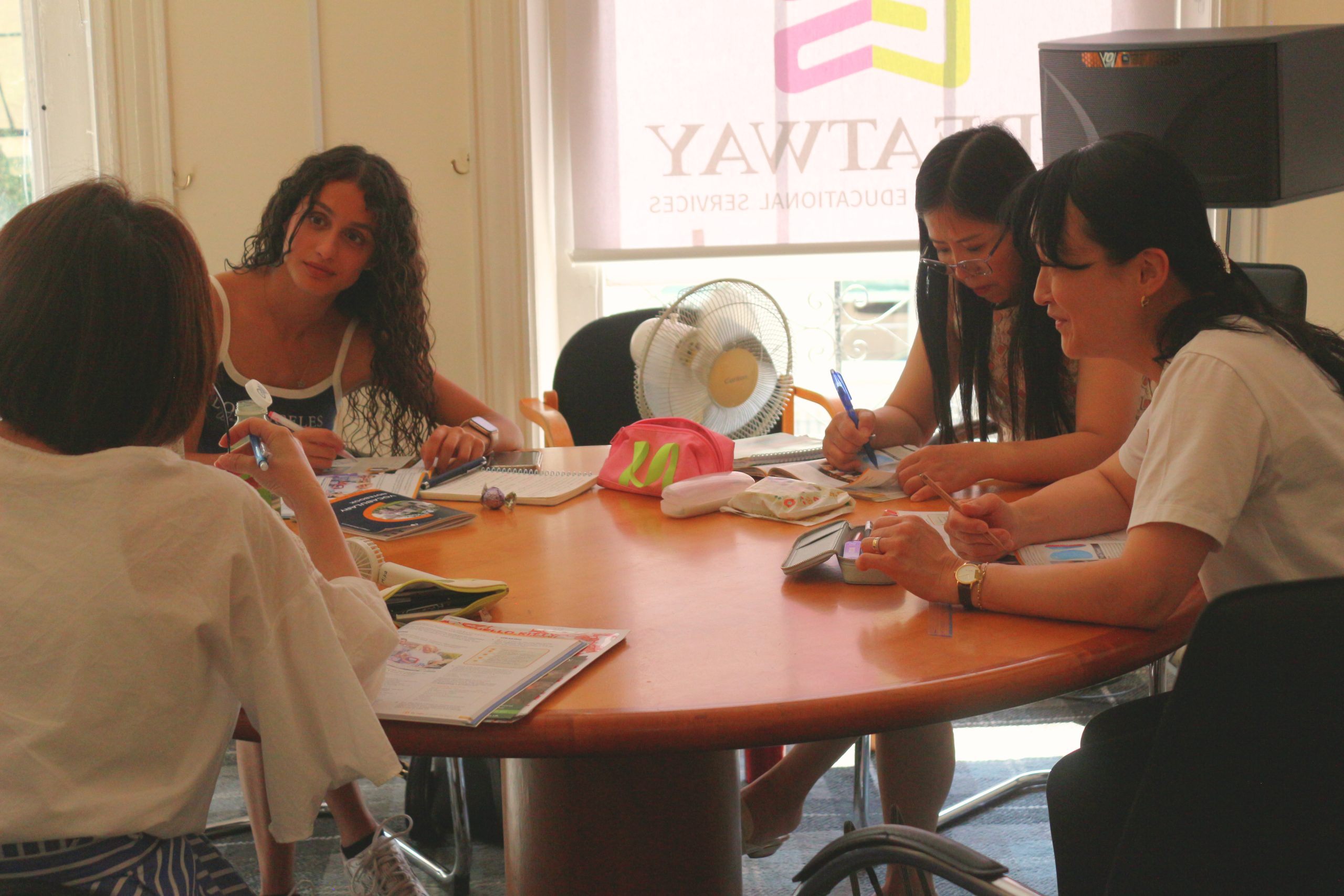 Students concentrating during an exam practice session at inlingua Cheltenham