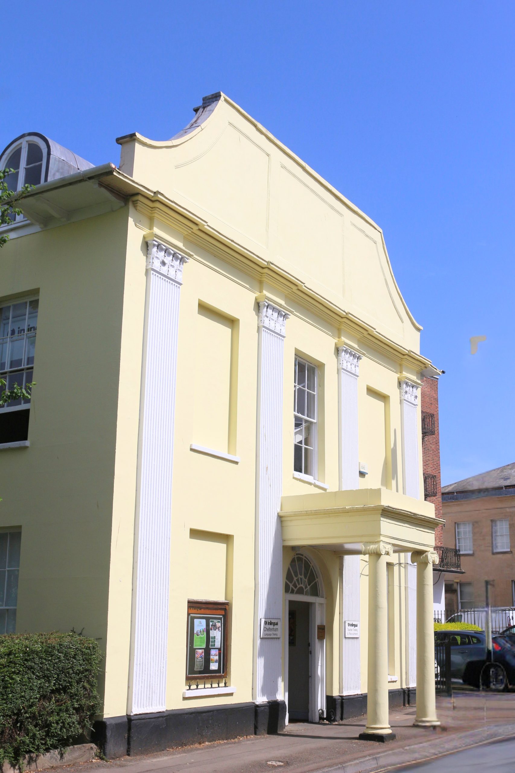 The Regency facade of inlingua Cheltenham with wrought-iron balconies