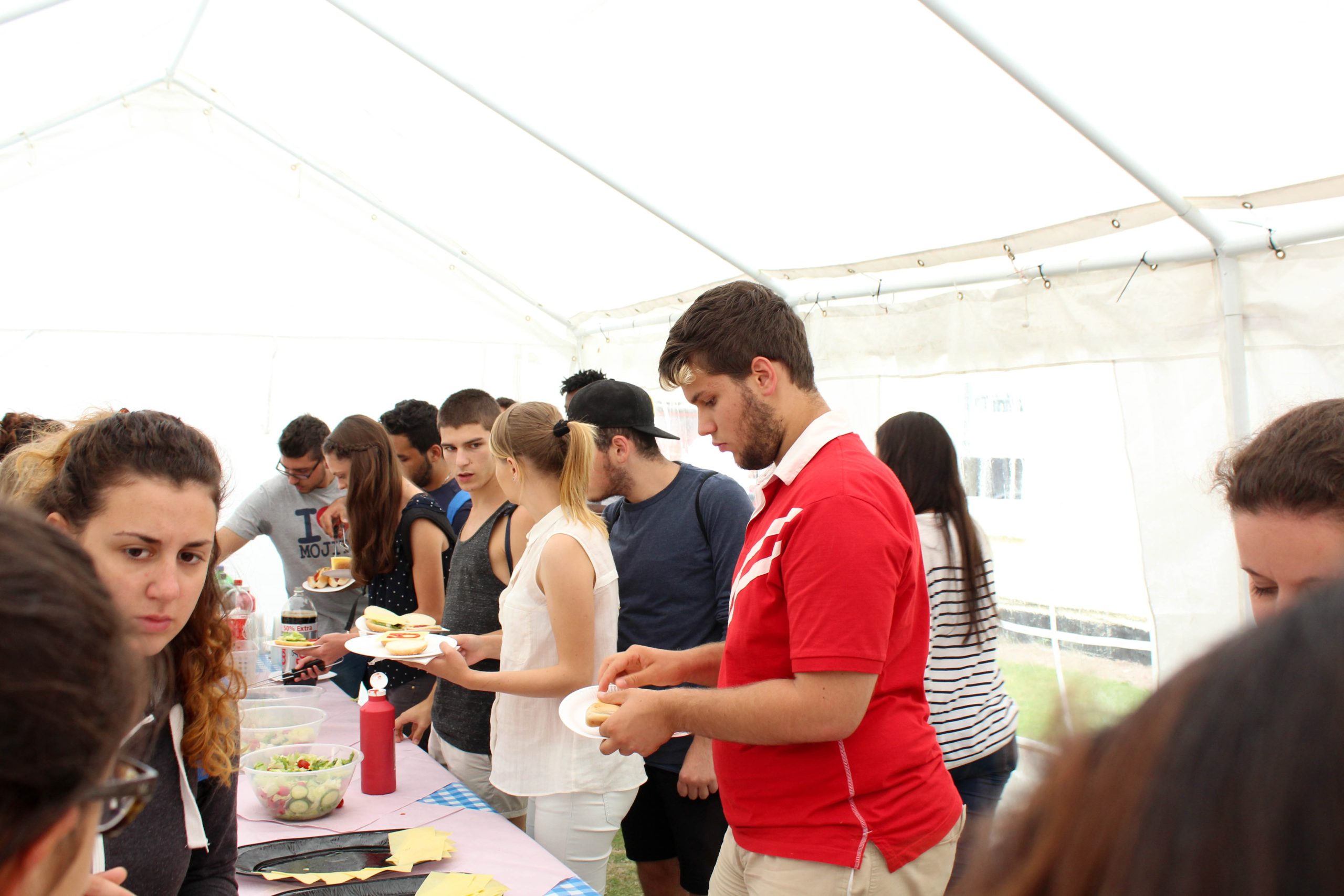 Students at a summer barbecue in the school garden