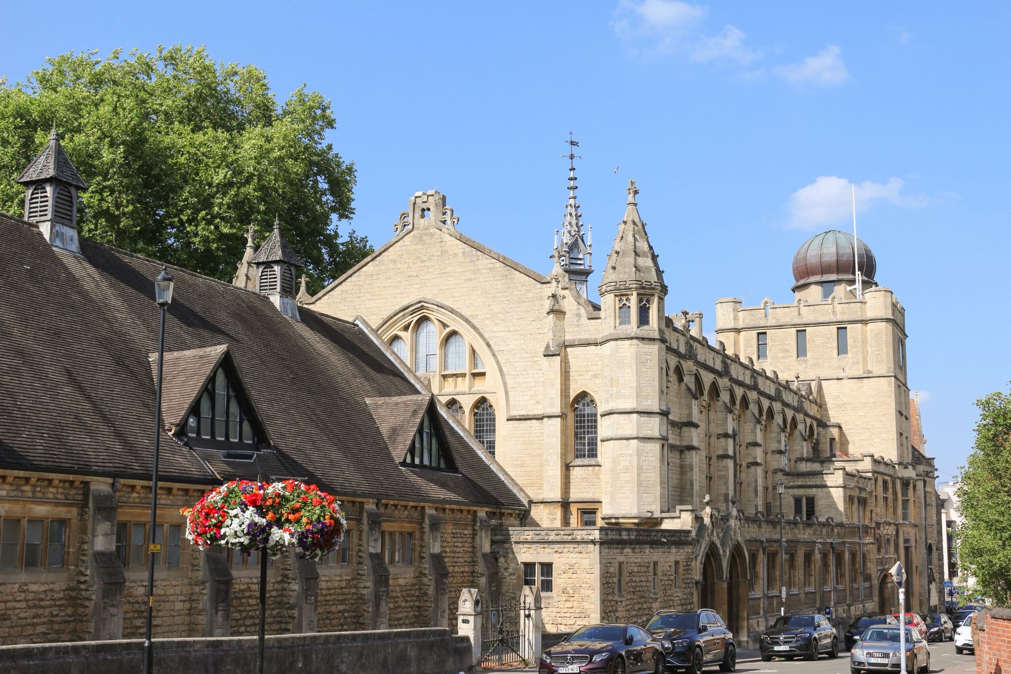 The historic buildings and grounds of a British boarding school near Cheltenham on a summer afternoon